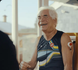Older man in cycling jersey — full arm and Zenith device visible